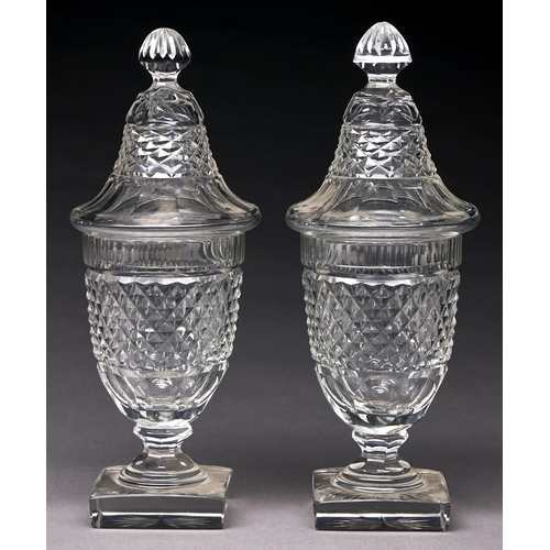 256 - A pair of shield shaped cut glass sweetmeat vases and covers, late 19th c, in Regency style, 24cm h... 