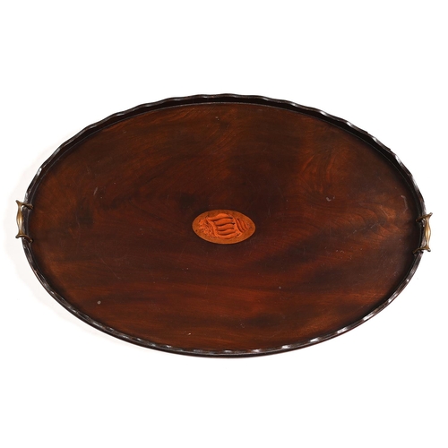 407 - A George III oval mahogany tea tray, the undulating gallery of laminated construction, 78cm l... 