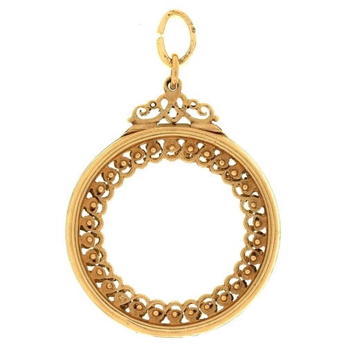 562 - An  9ct gold pendant-mount, 32mm diam, Birmingham 1989, 10g