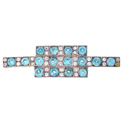 564 - A blue zircon and white stone brooch, c1930, adapted from a bracelet, mounted in white and gold colo... 