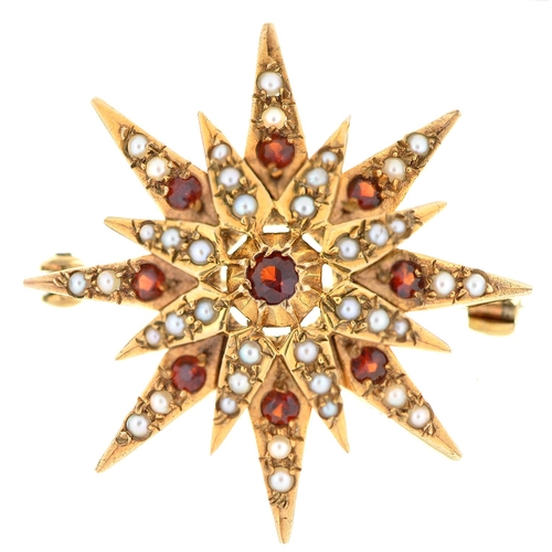 571 - A ruby and split pearl star brooch, in 9ct gold, 32mm, London 1974, 7.4g