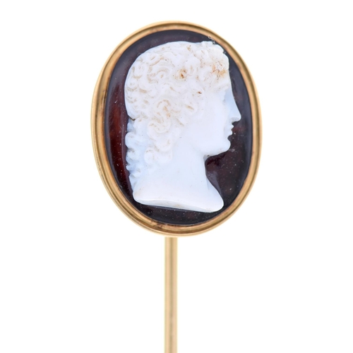 572 - A hardstone cameo, 19th c, of onyx, carved with the head of Venus, mounted in a gold stick pin, head... 