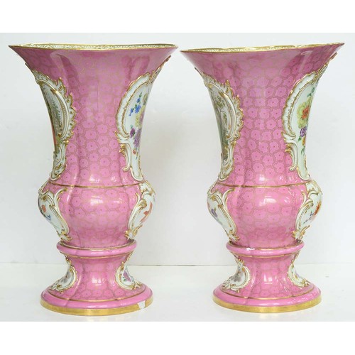 225 - A pair of Meissen campana shaped vases, c1840, painted with panels of 18th c courtship or flowers in... 