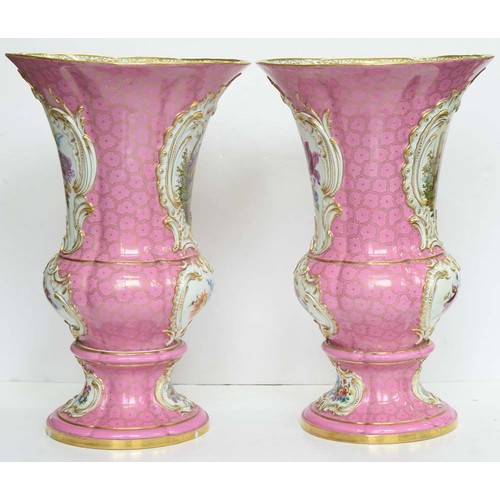 225 - A pair of Meissen campana shaped vases, c1840, painted with panels of 18th c courtship or flowers in... 