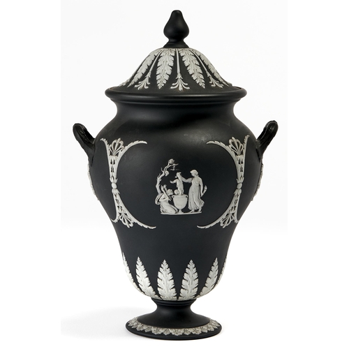 73A - A Wedgwood black jasper dip vase and cover, c1900, sprigged with neo classical ornament, 30cm h, imp... 