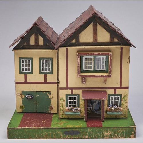 584 - A painted wood twin gabled doll's house, second quarter 20th c, 45cm and a quantity of contemporary ... 