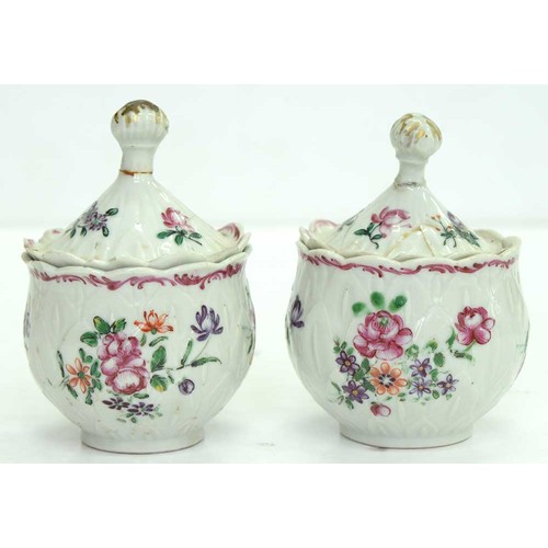 283 - A pair of Chinese export porcelain famille rose artichoke custard cups and covers, c1770, painted wi... 