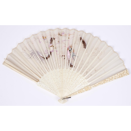 446 - A Chinese ivory fan, mid 19th c,  the silk leaf finely embroidered with a dragon, brise guards and i... 