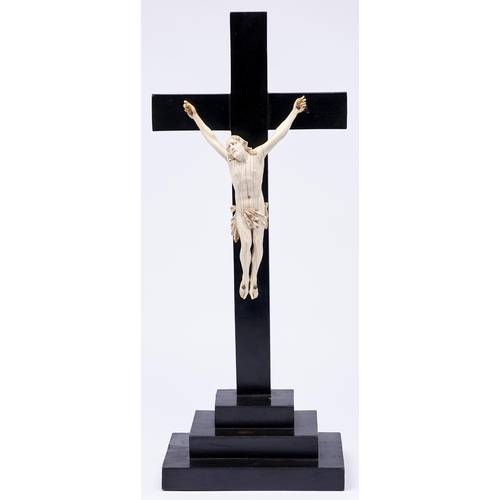 469 - A Dieppe ivory Corpus Christi, 19th c,  on ebonised cross, 23.5cm h, cross 55.5cm h... 