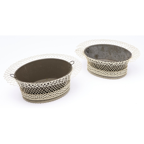 472 - A pair of oval cream painted wirework jardinieres in Regency style, tinplate liners, 45cm l... 