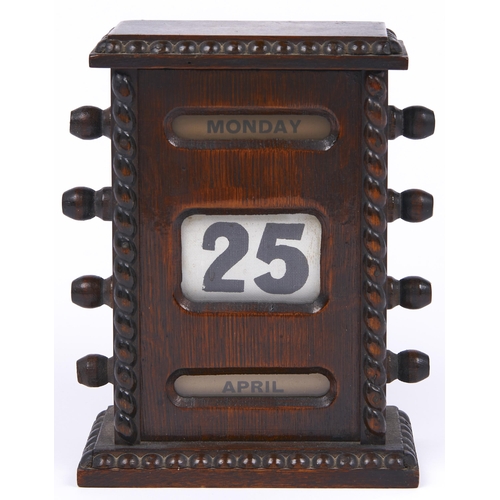 482 -  An oak perpetual calendar, c1920,  15.5cm h