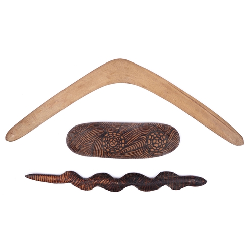 484 - Australia. A boomerang and two aboriginal carvings, one in the form of a snake, mid 20th c, boomeran... 