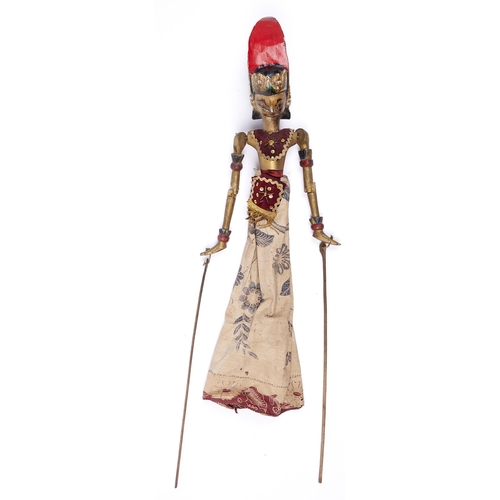 493 - A Javanese polychrome wood and sequin decorated cloth shadow puppet,  approx 66cm