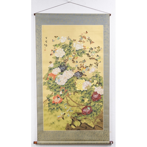 543 - Chinese School, 20th c - Scroll panel of rock, colourful chrysanthemum blooms and a profusion of but... 