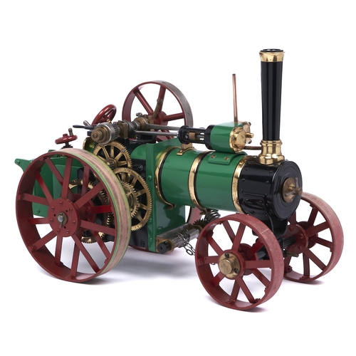 579 - A scratch built brass and ferrous metal model traction engine, painted green, black and red, overall... 