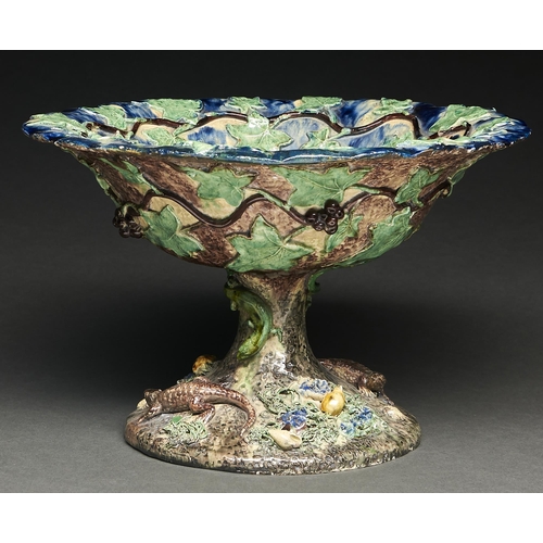 65 - A French Palissy ware footed bowl, late 19th c,  applied with reptiles, shells and foliage enci... 