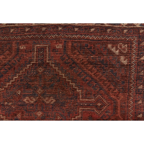 872 - An antique Caucasian rug, 112 x 172cm