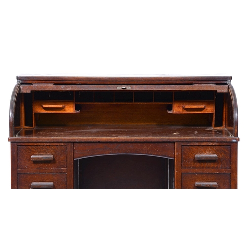 905 - A Lebus stained oak desk with tambour shutter, early 20th c, 107cm h; 68 x 122cm