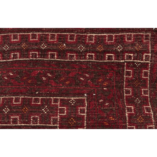 923 - An antique Caucasian rug, 112 x 200cm