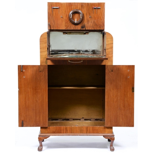 939 - A walnut cocktail cabinet, mid 20th c, on claw and ball feet, 124cm h; 38 x 74cm