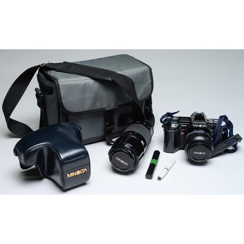 497 - A Minolta 7000 35mm SLR camera, with maker's F4 55-70mm AF lens and F4 75-110mm AF lens... 