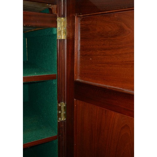 829 - A Victorian mahogany plate cupboard, the interior baize lined, enclosed by a pair of doors with rais... 