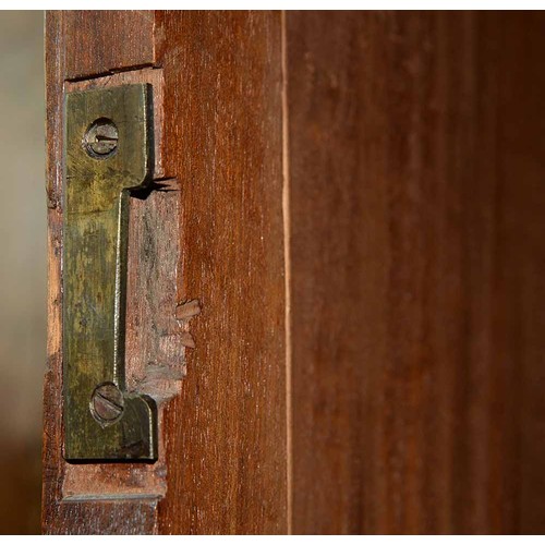 940 - A mahogany wardrobe, early 20th c, with dentil cornice and fitted for trays or other, enclosed by a ... 