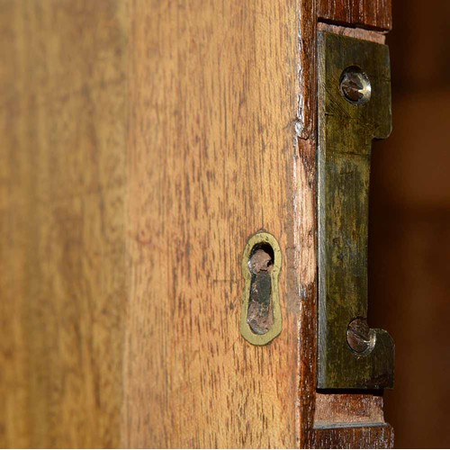 940 - A mahogany wardrobe, early 20th c, with dentil cornice and fitted for trays or other, enclosed by a ... 