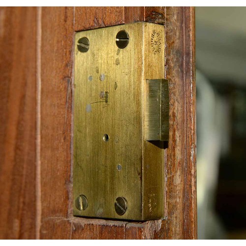 940 - A mahogany wardrobe, early 20th c, with dentil cornice and fitted for trays or other, enclosed by a ... 