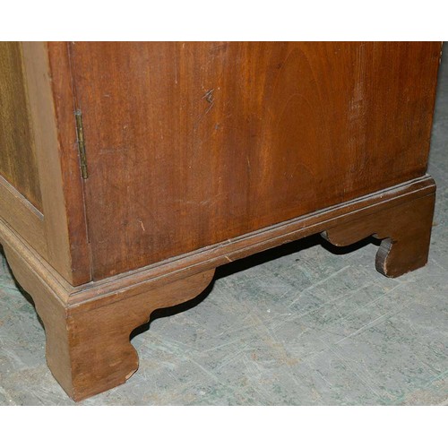 940 - A mahogany wardrobe, early 20th c, with dentil cornice and fitted for trays or other, enclosed by a ... 