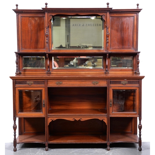 1342 - A Victorian walnut sideboard by Gillows, 1883-4, the panelled back with finials and bevelled mirrors... 