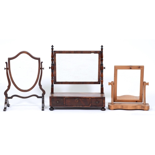 1377 - A George IV mahogany and ebonised dressing mirror, the figured base fitted with three drawers on bun... 