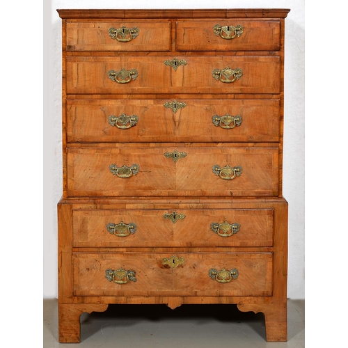 1240 - A George II walnut chest on chest, the upper part with figured top and moulded cornice, fitted two s... 