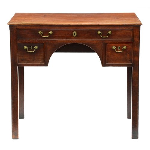 1243 - A George III mahogany lowboy, with moulded top and fitted three cockbeaded drawers to the arched apr... 