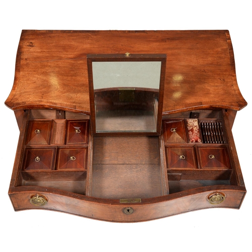 1246 - A George III serpentine mahogany dressing table, with broken line inlay and oval paterae, the drawer... 