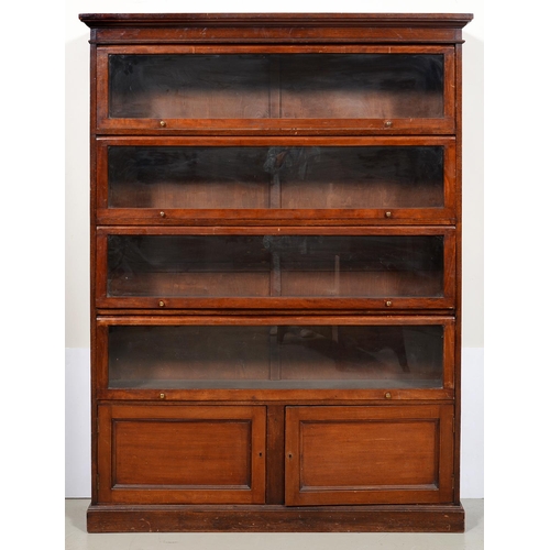 1252 - An Edwardian mahogany bookcase, the moulded cornice above four glazed up-and-over doors, the lower p... 