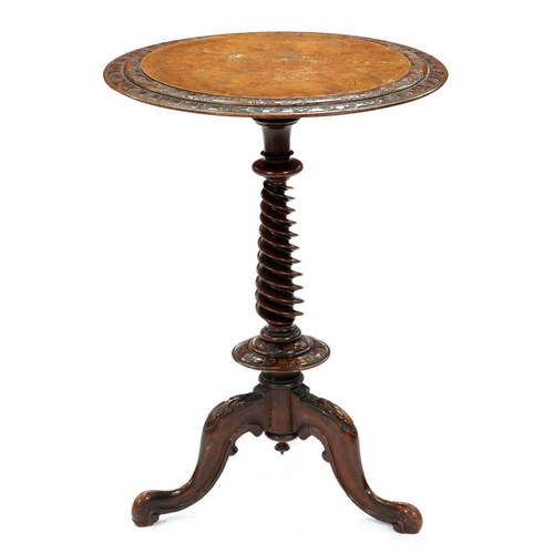 1261 - A Victorian burr walnut  tripod table, c1865, the round top with figured panel within foliate carved... 