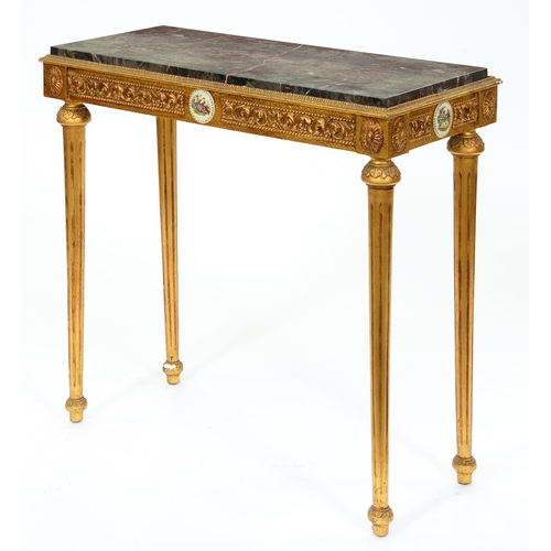 1291 - A reproduction gold painted marble topped side table, in Louis XVI style, on fluted tapered legs, 82... 