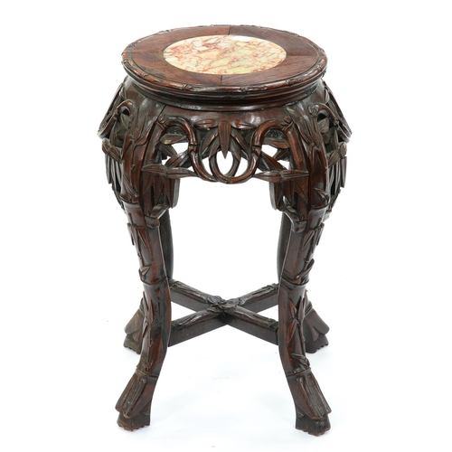 1293 - A Chinese hardwood stand, first half 20th c, with marble inset top and carved with bamboo, 48cm h, t... 