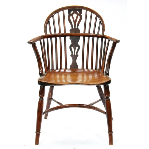 1304 - A Victorian yew wood Windsor chair, North Nottinghamshire, with crinoline stretcher and elm seat, se... 