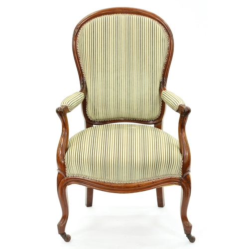 1305 - A French walnut armchair, 19th c, in Louis XV style, seat height 40cm