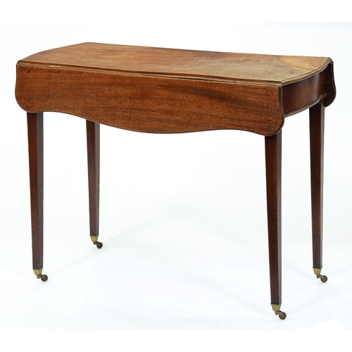 1317 - A George III mahogany Pembroke table, the serpentine top on square tapered legs and brass castors, 7... 