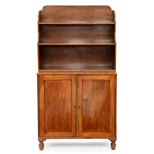 1318 - A George IV mahogany bookcase, the superstructure of three open shelves with breakarched top, the lo... 