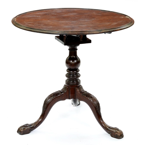 1321 - A George II mahogany tripod table, the dished top on baluster pillar with birdcage action, the legs ... 