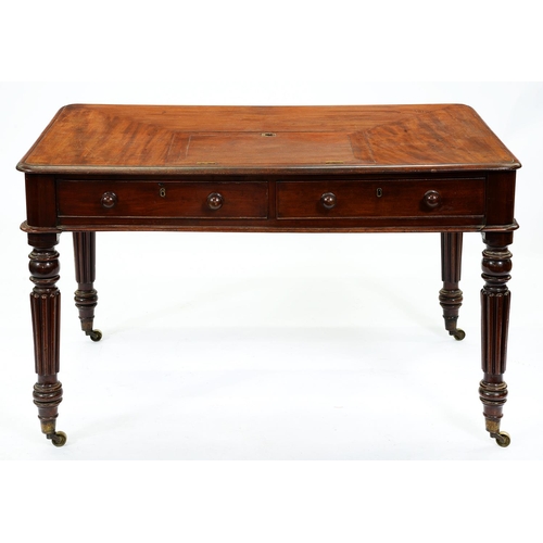 1322 - A Victorian mahogany writing table in the manner of Gillows, the adjustable rest with brass rin... 