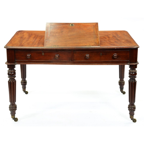 1322 - A Victorian mahogany writing table in the manner of Gillows, the adjustable rest with brass rin... 