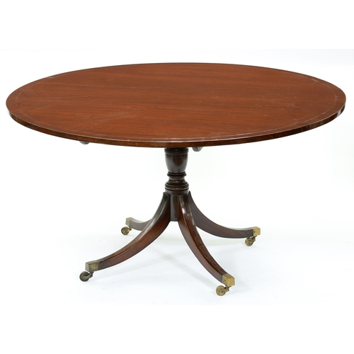 1330 - A mahogany breakfast table, 19th c, the round top on turned vase pillar and quadruple ebony line inl... 