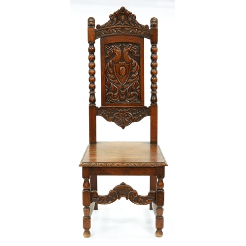 1357 - A Victorian carved oak hall chair,  the crested back flanked by lions' heads, the panel carved with ... 