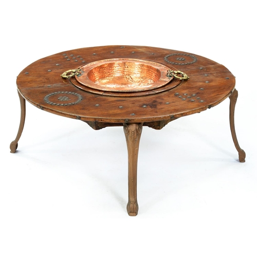 1360 - A Spanish chestnut brasero, 19th c,  with brass handled copper bowl on associated bronze painted cas... 