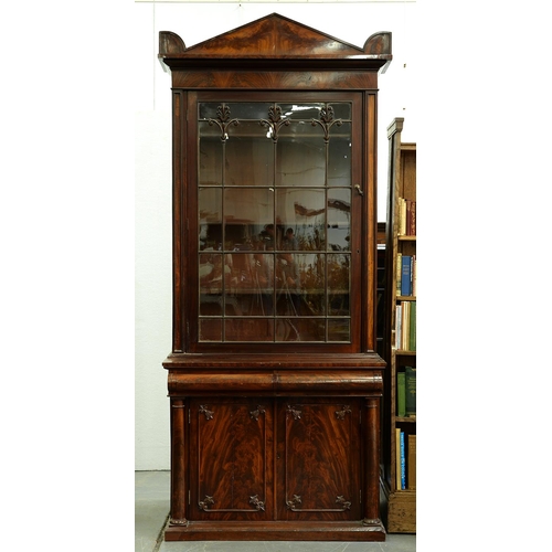 1382 - A William IV mahogany bookcase, the figured pediment with acroteria above similarly figured frieze, ... 